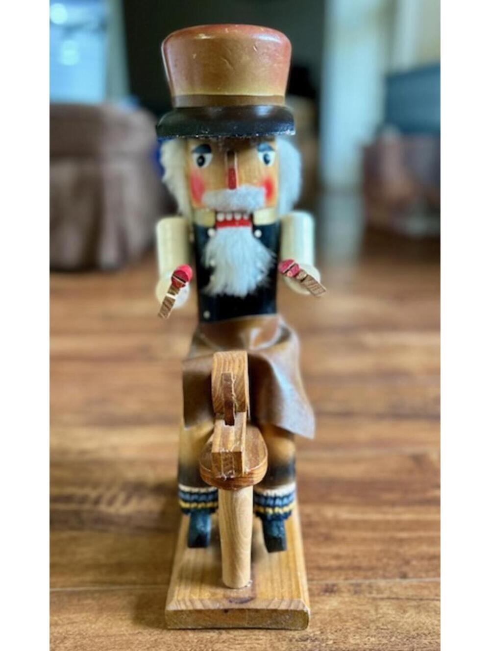 Vintage Wooden Nutcracker Figurine with Seated Design